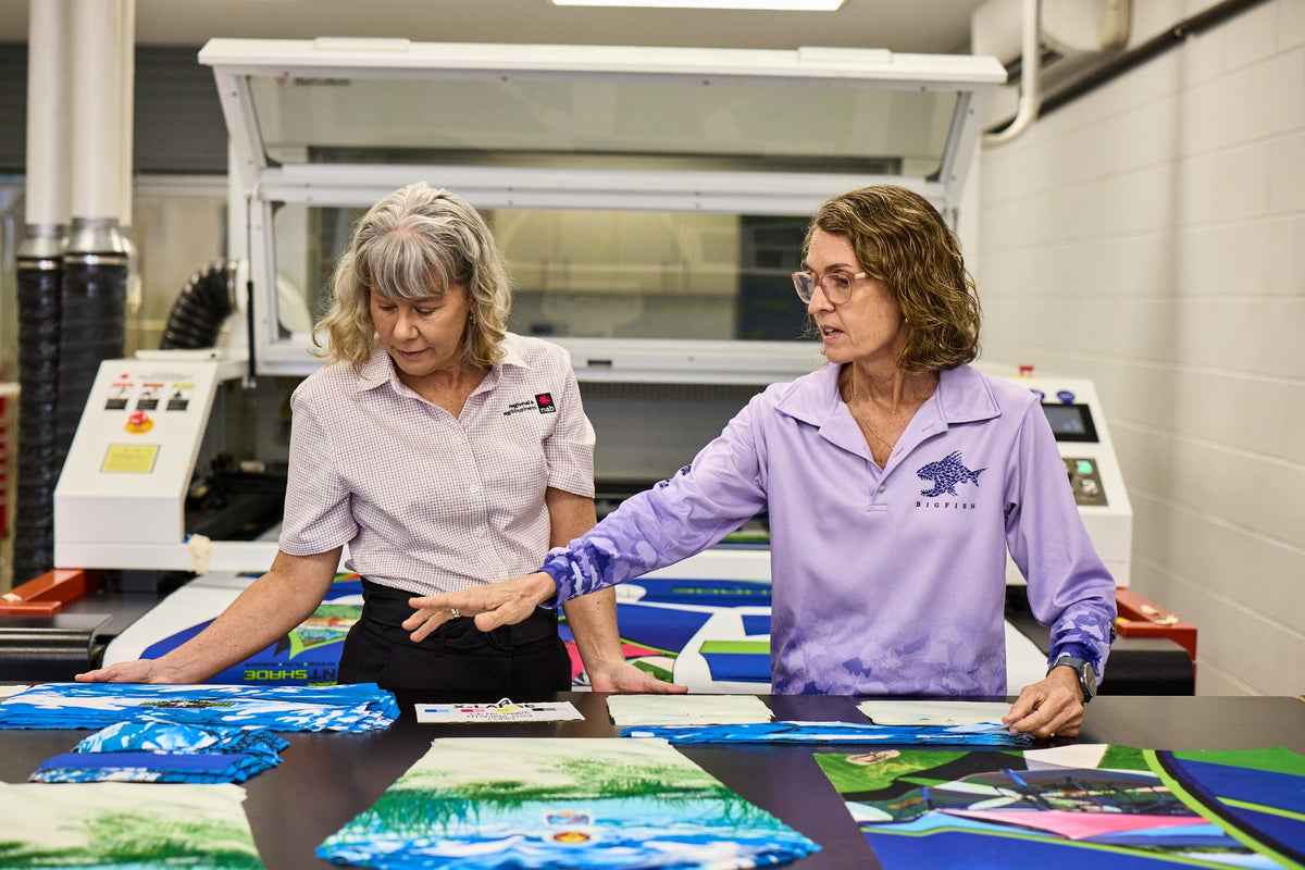 Bigfish team reviewing custom print proofs in the Darwin workshop