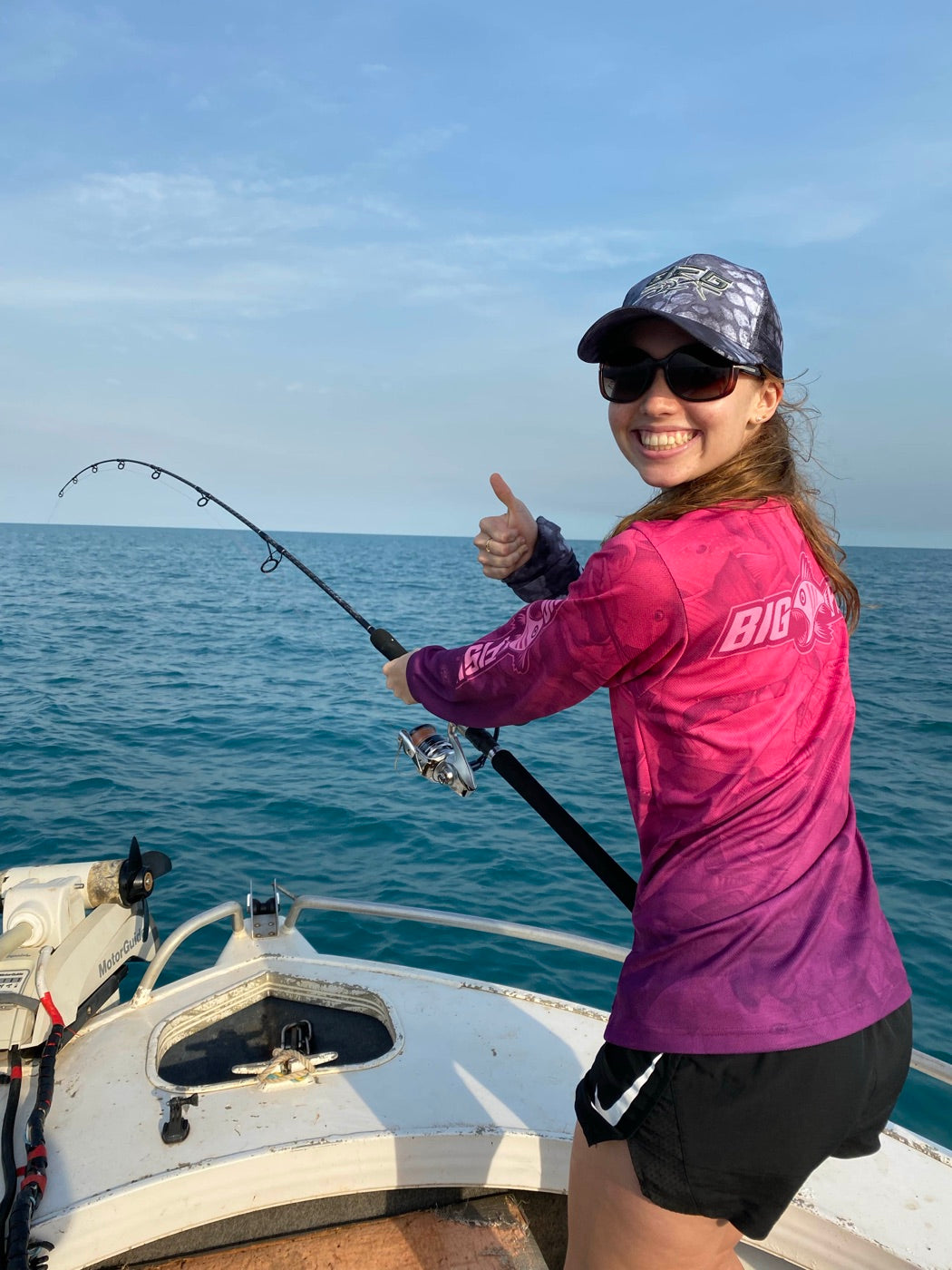 Angler giving a thumbs up in the Aus Camo Plum fishing shirt